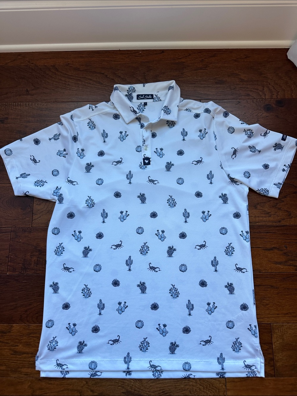 Bad Birdie White Polo with Blue Desert Motif